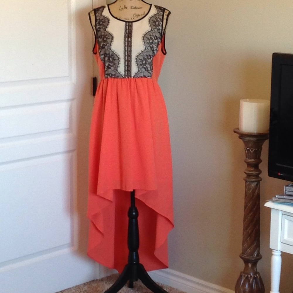 Hi-Lo sleeveless coral and black dress.